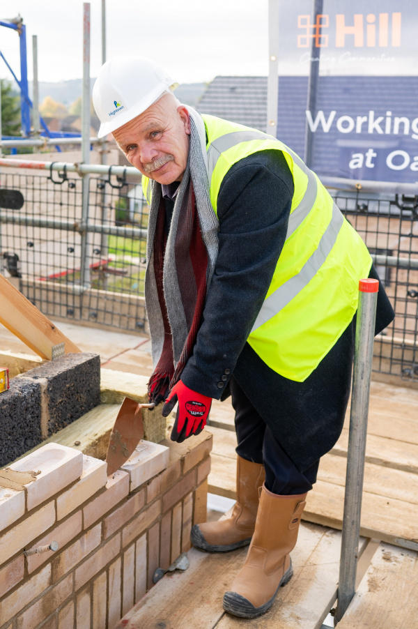 Cllr Tom Shaw, portfolio holder for housing at Luton Borough Council, laying a brick.